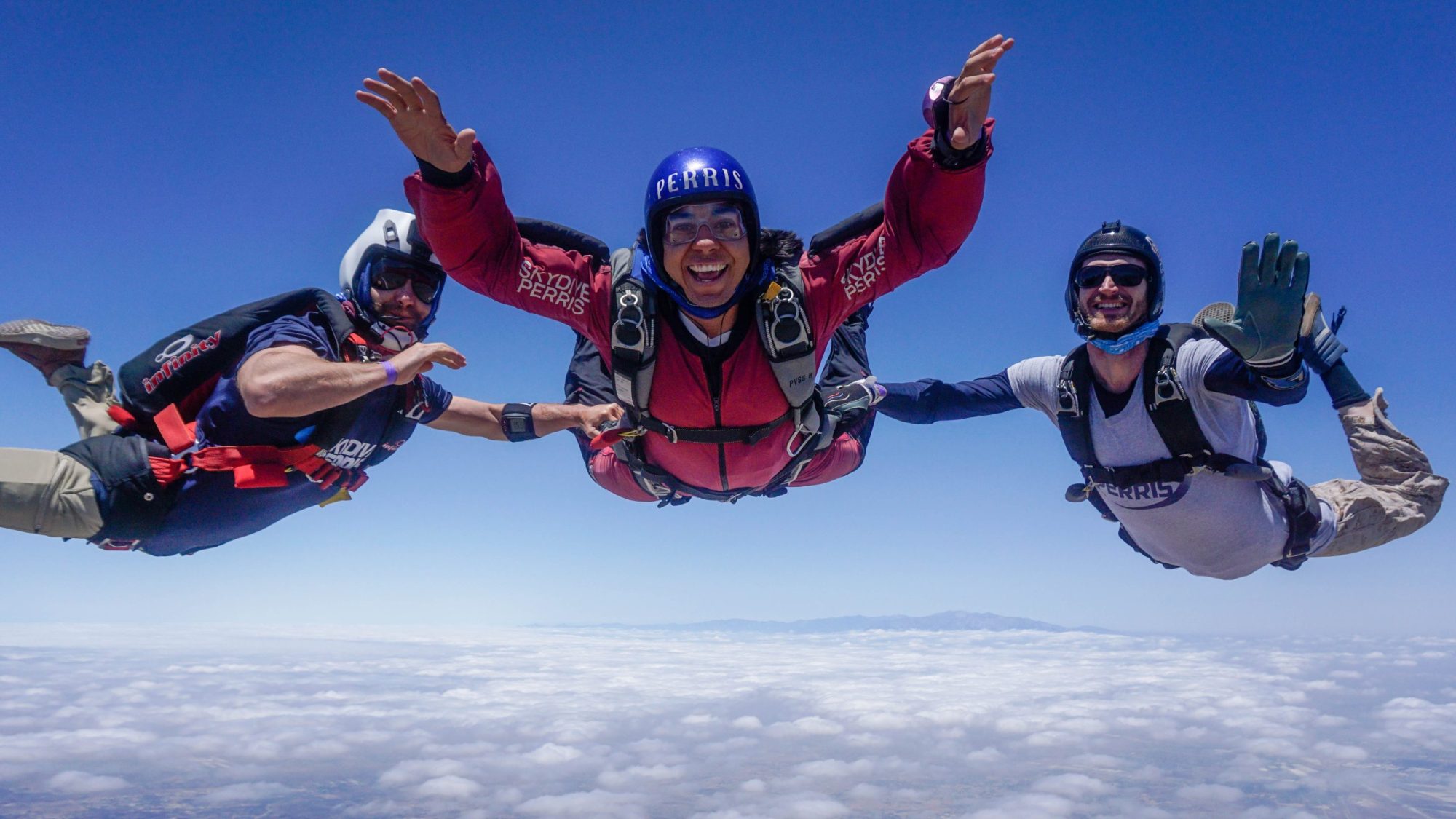 Student skydiver under canopy with an instructor alongside