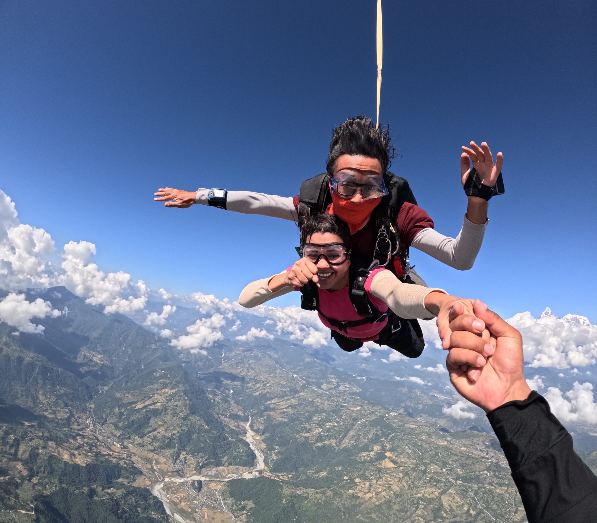 Tandem pair under canopy above Pokhara