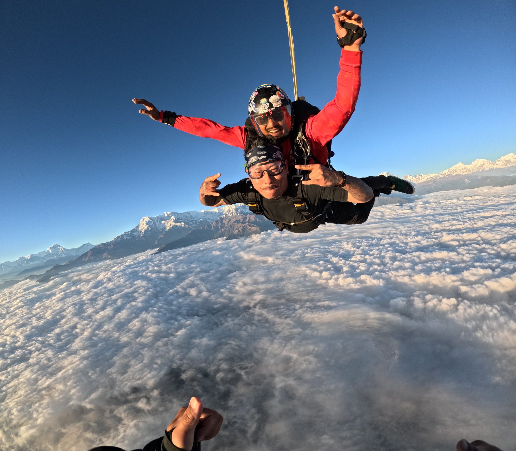 Tandem pair in freefall above the Annapurna range